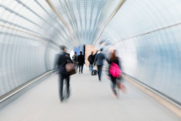 istock Crowd of People Rushing Through Tunnel, Blurred Motion, London 1074636832