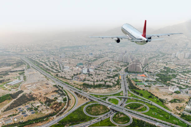 istock An airplane over Tehran city. 1074639250