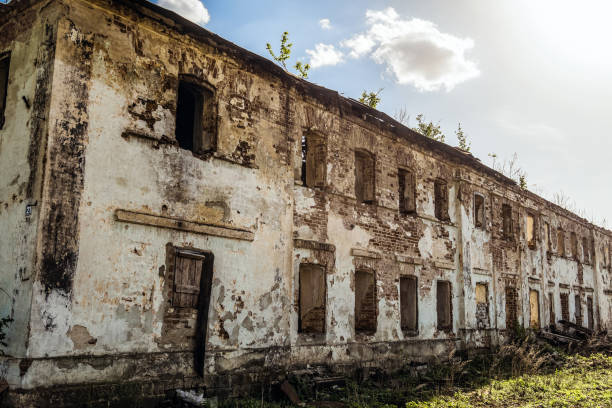 istock Old abandoned dilapidated residential building with brick walls 1074643134