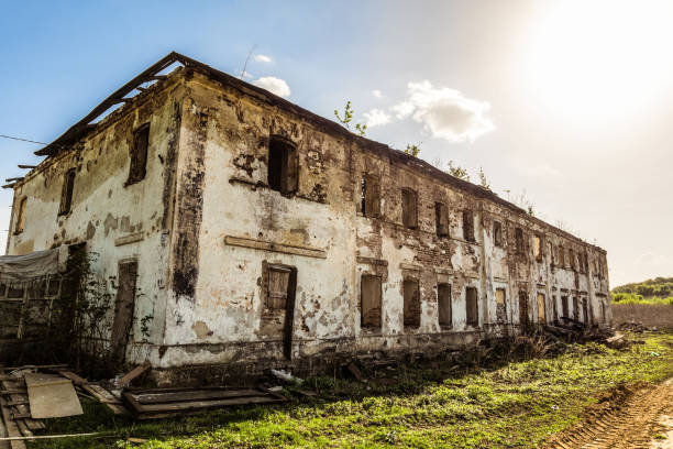 istock Old abandoned dilapidated residential building with brick walls 1074643150