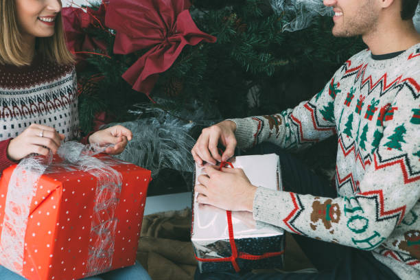 istock Young woman and man with Christmas presents 1074643638