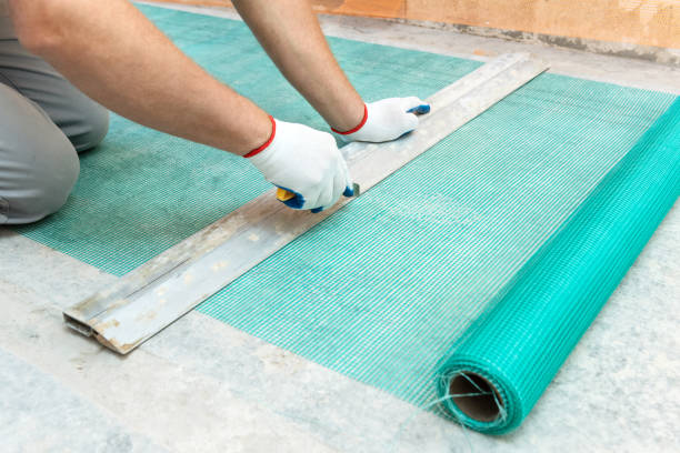 istock A worker is cutting  a fiberglass mesh. 1074643866