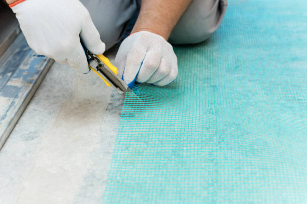 istock A worker is cutting  a fiberglass mesh. 1074643874