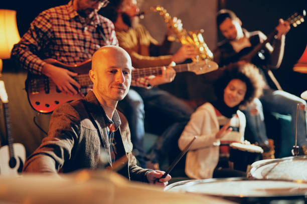 istock Jazz band playing music in home studio. 1074648226