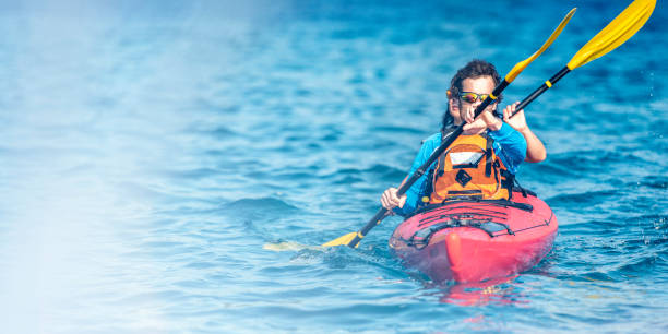 istock Kayaker couple on the blue sea 1074651320