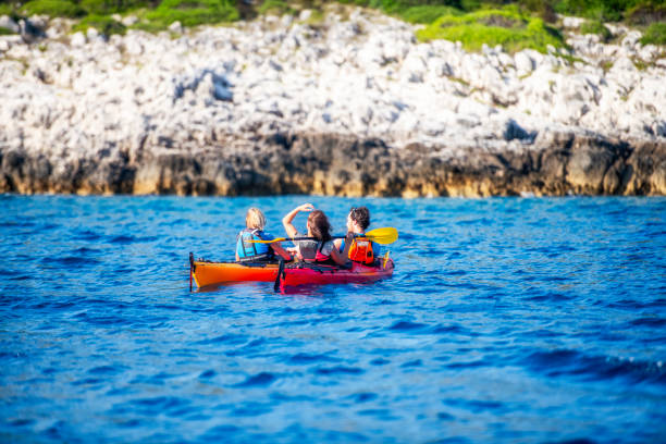 istock Kayakers taking a break at sea near the shore 1074651386