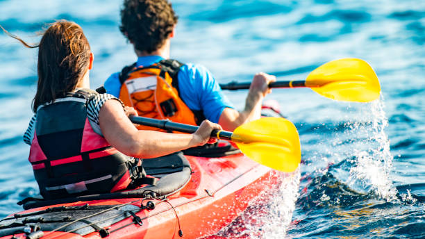 istock Unrecognizable couple kayaking at sea 1074651420
