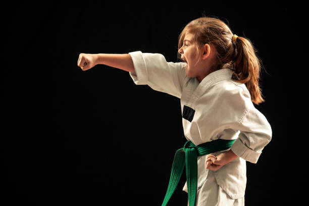 istock Girl on taekwondo training 1074659058