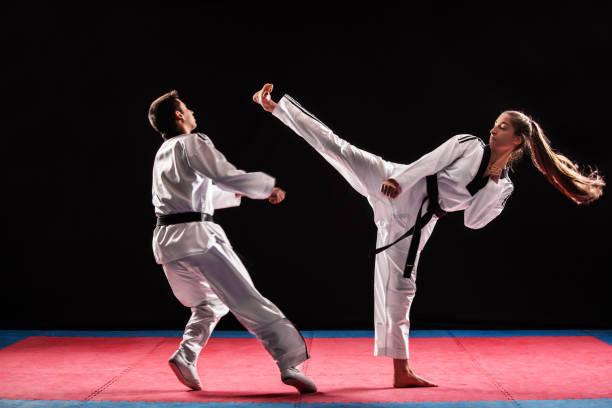 istock Man and woman taekwondo combat 1074659206