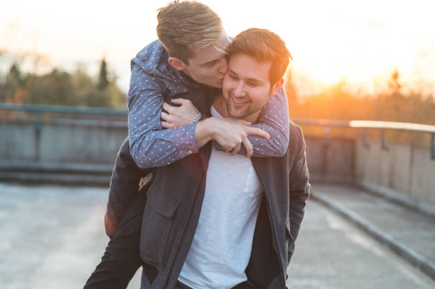 istock Affectionate male couple walking together in the evening 1074661666
