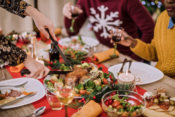 istock Cutting Fresh Baked Chicken On Christmas Eve 1074669562