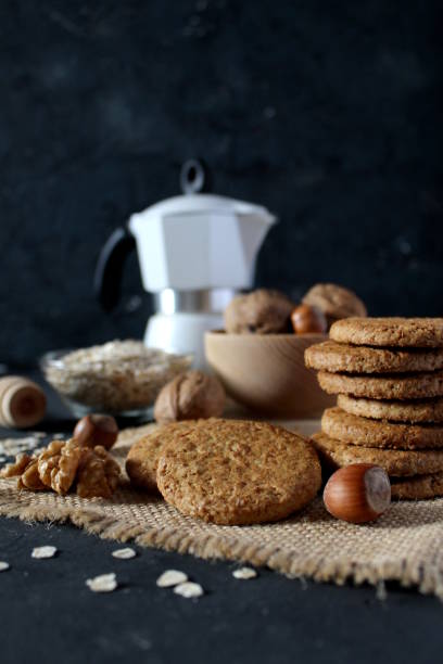 istock Sweet biscuit barley, oats and walnuts on the dark background. 1074671262