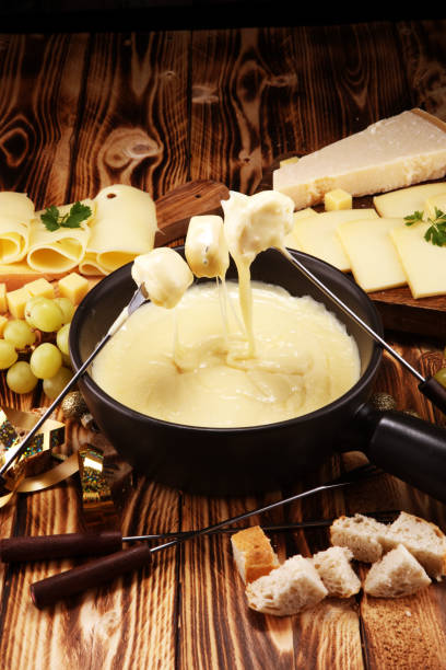 istock Gourmet Swiss fondue dinner on a winter evening with assorted cheese 1074674674