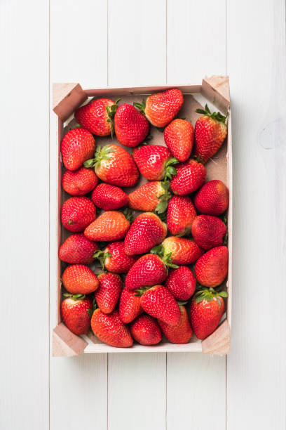 istock Fresh strawberries in wooden basket 1074675204