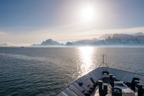 bow of cruiseship cruising in gerlache strait to orne harbour on arctowski peninsula, antarctic peninsula, antarctica - climate change south pole antarctica imagens e fotografias de stock