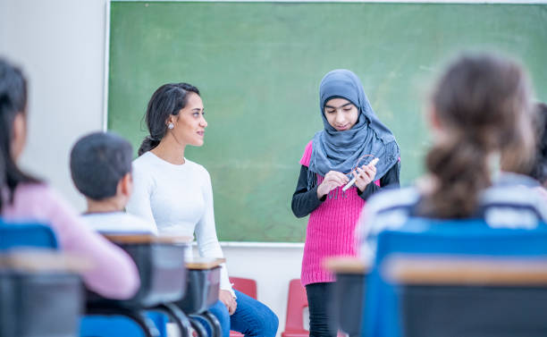 istock Little girl giving a presentation 1074689162