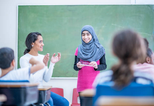 istock Muslim girl giving a presentation 1074689166