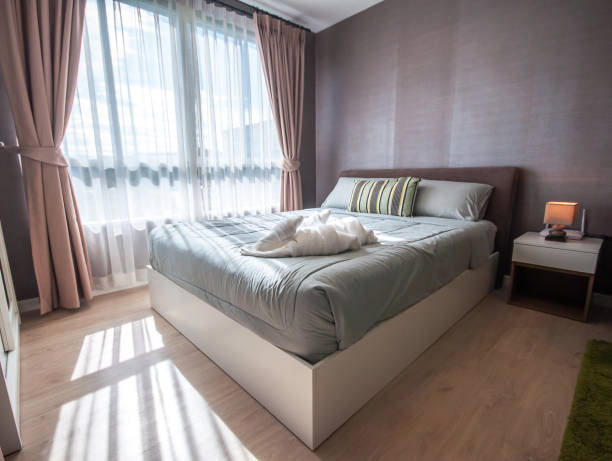 istock Beautiful bedroom interior and towels 1074689224