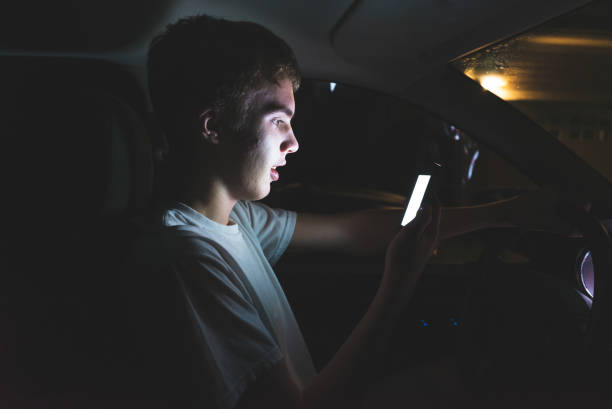 istock Teenager texting before he begins driving. 1074709526