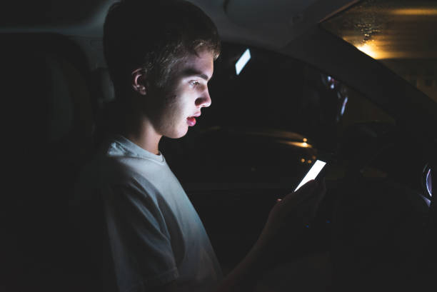 istock Teenager texting before he begins driving. 1074709528