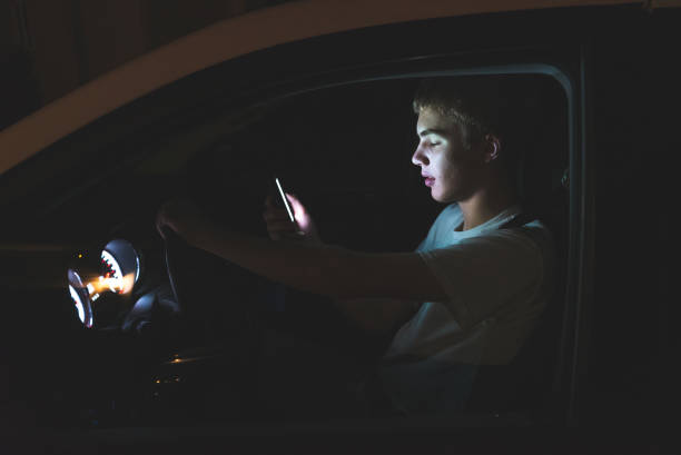 istock Distracted teenage driver. 1074712592