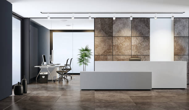 Contemporary office reception area with copy space white reception desk with copy space in entrance area of an office building 
with natural slate stone large brown veneer tiles. lobby area with two white 
leather armchairs in front of black wall and two white computer desks. 
white ceiling with white spotlights headquarters photos stock pictures, royalty-free photos & images