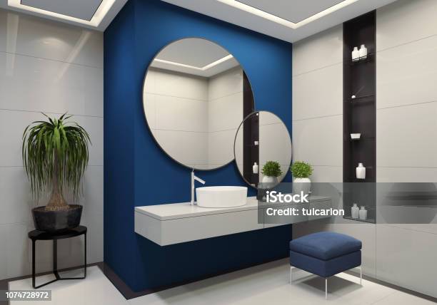 Luxury Minimalist Bathroom With Royal Blue Wall And Large White Tiles Stock Photo - Download Image Now