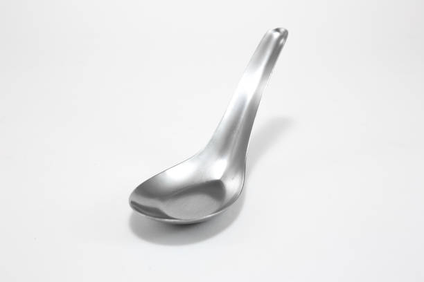 istock Stainless steel spoon on white background 1074734794
