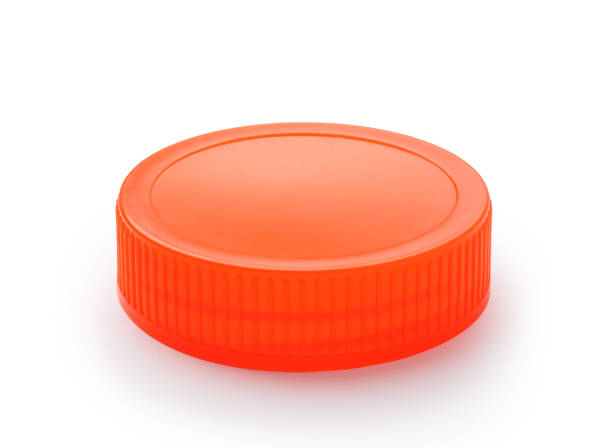 istock Orange plastic lid of jar 1074734928