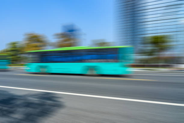 istock Car driving on road in city 1074736252