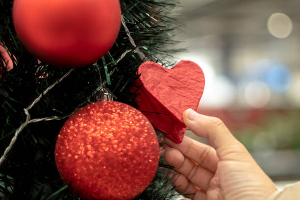 istock choosing Christmas tree and ornaments 1074738200