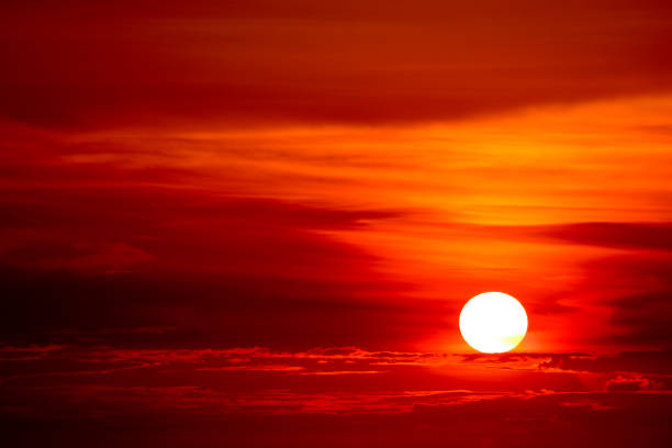 istock last light of sunset on  sky cloud ray around sun 1074747946