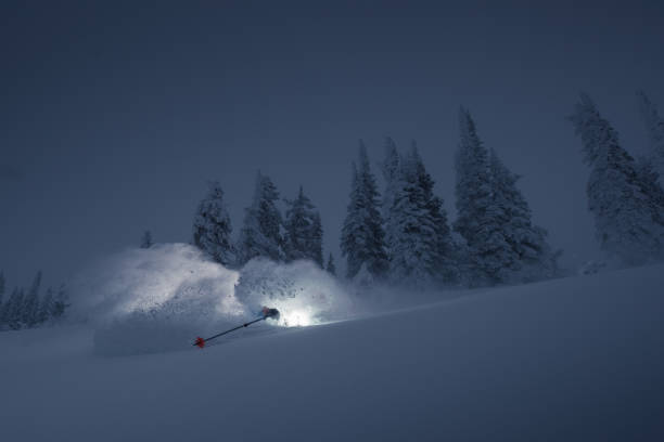 Storm skiing Storm skiing on powder day. ski resort flash stock pictures, royalty-free photos & images