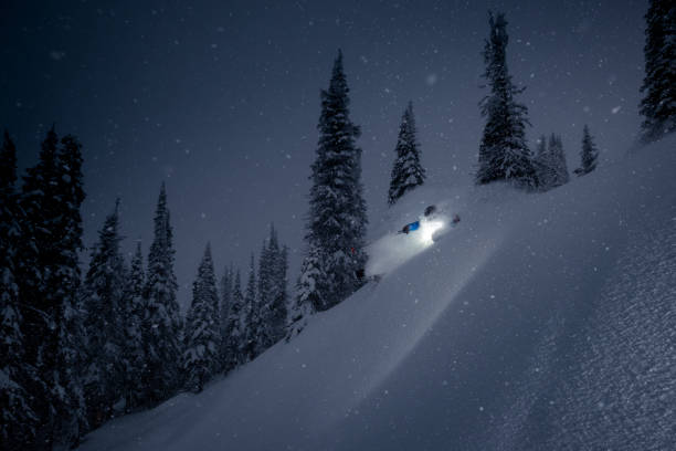 Storm skiing Storm skiing on powder day. ski resort flash stock pictures, royalty-free photos & images