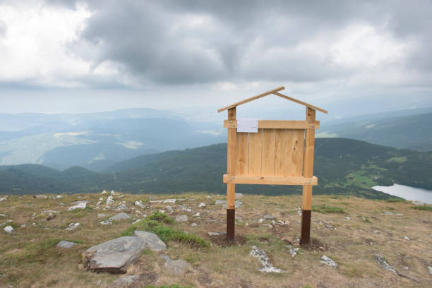 Wooden signboard in the mountain top