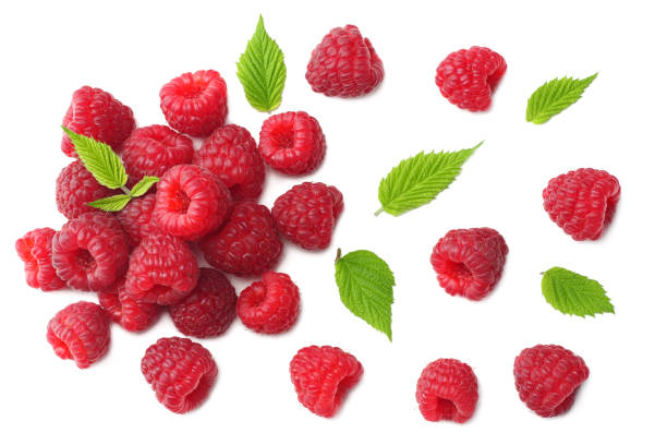 istock ripe raspberries with green leaf isolated on white background. top view 1074780228