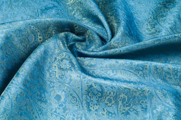 istock Background texture, pattern. Blue paisley silk chiffon mod fabric by the yard. Crinkled, flowy, soft, very light, 1074780978