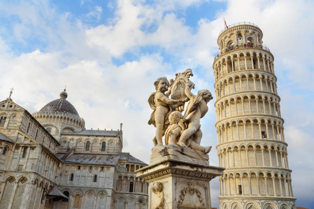 putti fountain and leaning tower. pisa, italy - cityscape pisa italy leaning tower of pisa imagens e fotografias de stock
