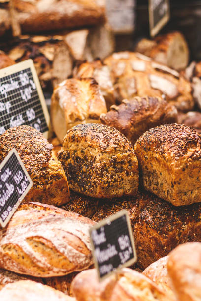 istock Loafs the bread on a showcase in a French bakery. 1074783324