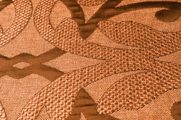 istock Texture, background, pattern. Fabric Tweed cotton golden-brown with a floral pattern 1074784786