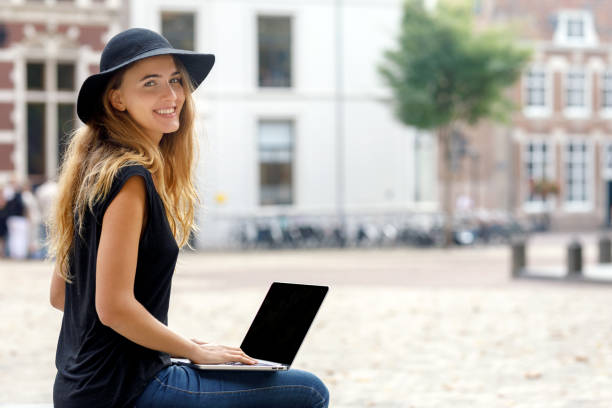istock Female College Student Working On Laptop 1074786832