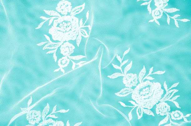 texture, background, pattern. lacy white fabric. flowers made of lace fabric. blue background of silk fabric. greeting card. wallpaper for your desktop. screensaver backdrop for designer - 24241 imagens e fotografias de stock