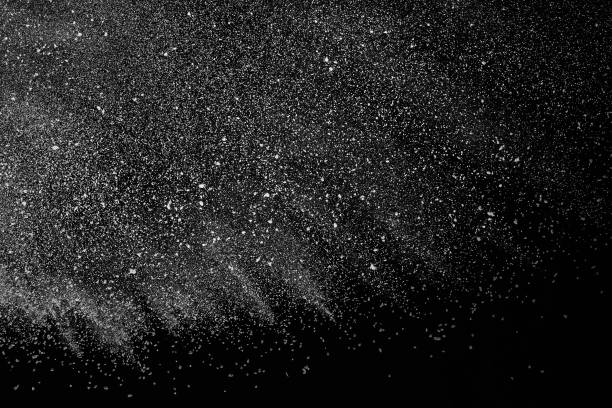 istock Freeze motion of white particles on black background. 1074789422