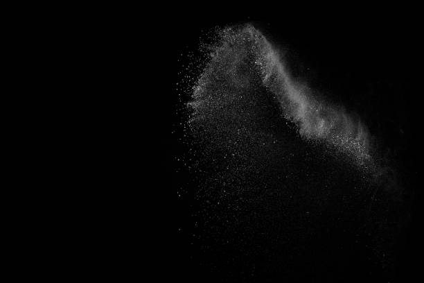 istock Freeze motion of white particles on black background. 1074789440