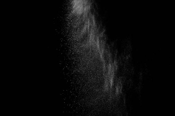 istock Freeze motion of white particles on black background. 1074789488
