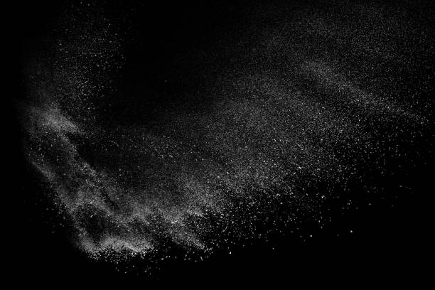 istock Freeze motion of white particles on black background. 1074789506