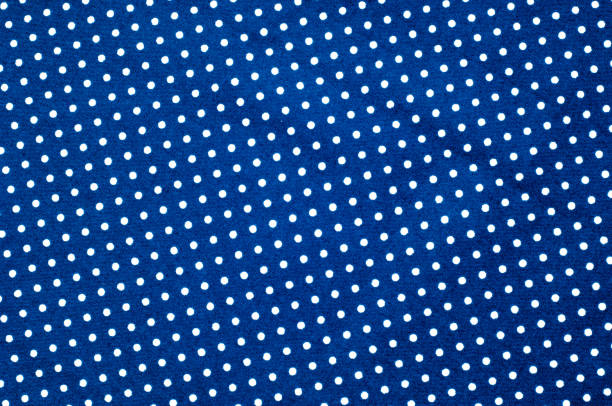 istock Texture background pattern. Abstract background of a luxurious blue fabric in white polka dots wavy folds of a grunge silk texture of a satin velvet material or a luxurious background or elegant wallpaper 1074792190