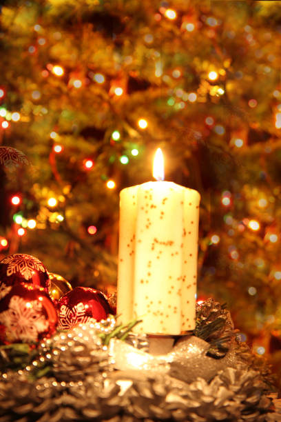 istock christmas tree and the candle 1074793286