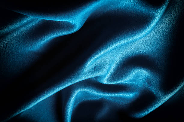 istock Texture, background. template. Silk fabric blue, Blue silk drapery and upholstery fabric from the courtyard - Dark curtains - Solid fabrics for backs and pillows 1074800390