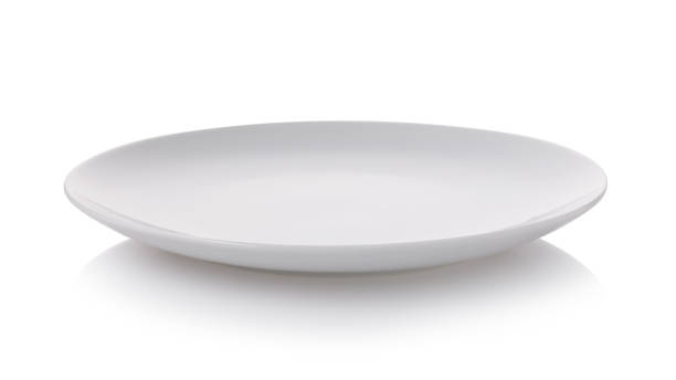 White empty ceramic plate, side view of an isolated object stock photo